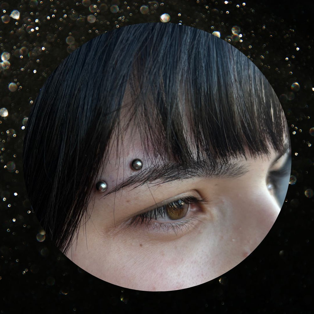 horizontal eyebrow  Piercing Mr.Inkwells Tattoo and Piercing Shop OC's Best