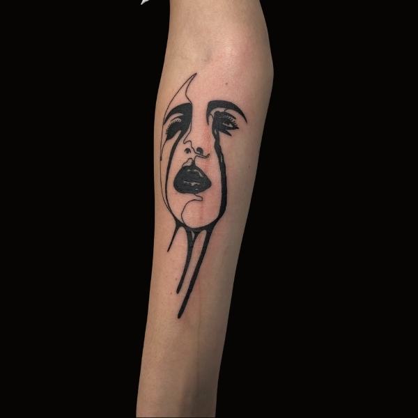 Blackwork Bleeding Face tattoo