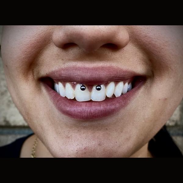 Smiling Piercing Mr. Inkwells Tattoo  and Piercing Shop