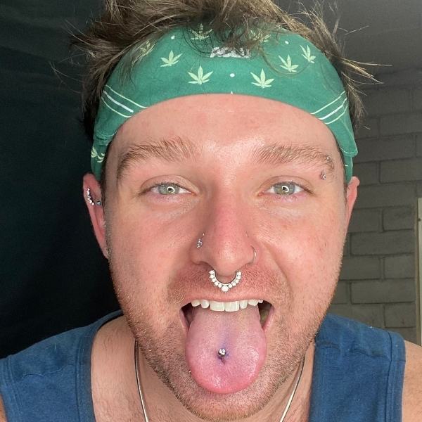 Tongue Piericng Mr. Inkwells Tattoo  and Piercing Shop