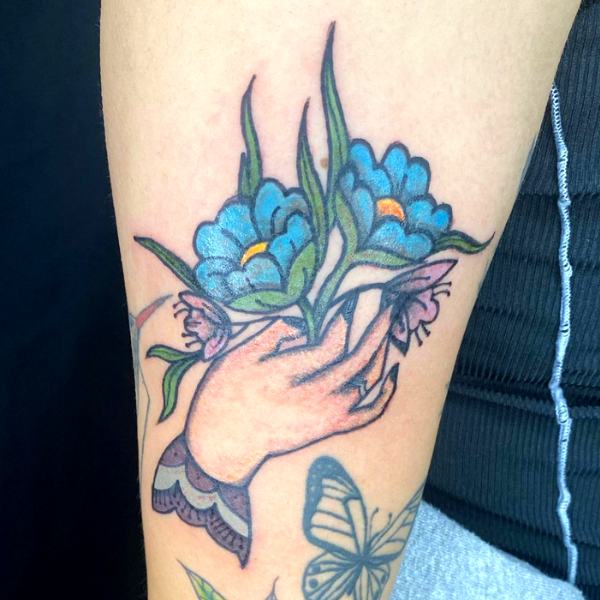 Traditional Hand Tattoo with Flowers